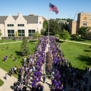 Incoming freshmen March Through the Arches to celebrate the start of their college journey and the start to the 2019 academic year on September 3, 2019, in St. Paul.