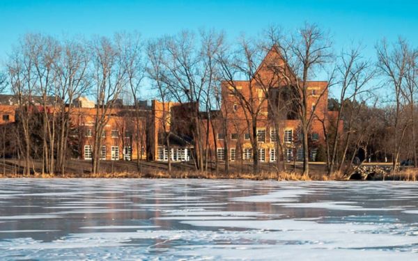 Bethel campus buildings sit beyond a frozen pond.